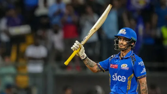 Mumbai Indians' Ishan Kishan celebrates scoring fifty runs during the IPL 2024 cricket match against Royal Challengers Bengaluru and Mumbai Indians at Wankhede Stadium, in Mumbai, Thursday, April 11, 2024