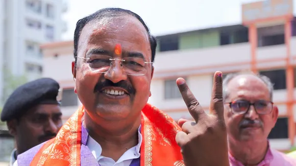 Uttar Pradesh Deputy Chief Minister Keshav Prasad Maurya shows his finger marked with indelible ink after casting his vote at a polling station during the sixth phase of the Lok Sabha elections, in Prayagraj, Saturday, May 25, 2024