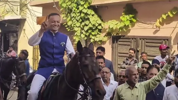 BJP leader Naveen Jindal arrives at a polling station riding horse to cast his vote for Haryana Assembly polls, in Kurukshetra, Saturday, Oct. 5, 2024