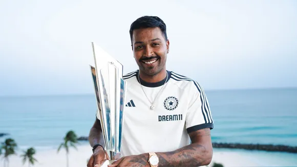 Indian cricket player Hardik Pandya poses with the 2024 ICC Men's T20 World Cup trophy, in Barbados.