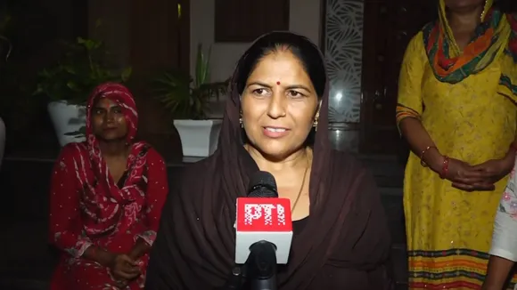 Saroj Devi, mother of athlete Neeraj Chopra, speaks after his son won Silver medal in the Javelin throw at the Paris Olympic, in Khandra village of Panipat district, Friday, Aug. 9, 2024.