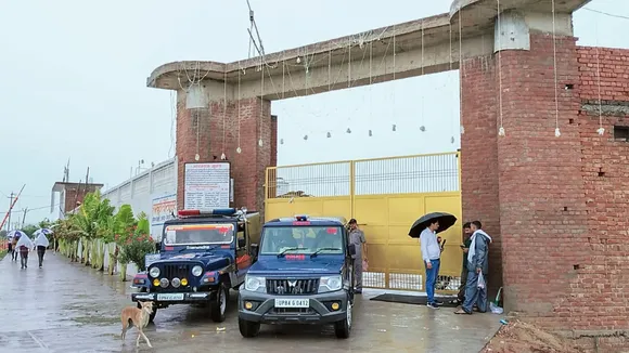 Police personnel outside the Bhole Baba's Ashram, in Bichhwa of Mainpuri district, Wednesday, July 3, 2024.