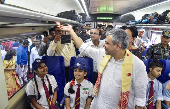 Union Railways Minister Ashwini Vaishnav inside the Vande Bharat Express with school students ahead of its flag-off, at Guwahati Railway station in Guwahati