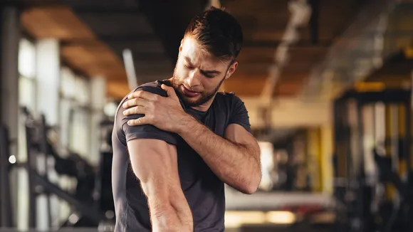 man muscles sore after exercise