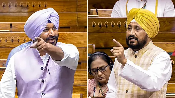 Union Minister of State and BJP MP Ravneet Singh (L) and Congress MP Charanjit Singh Channi speak in the Lok Sabha during the Monsoon session of Parliament, in New Delhi, Thursday, July 25, 2024.