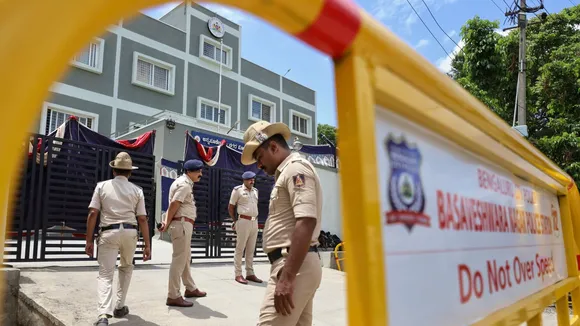Police personnel put up baricades amid restrictions near the Annapoorneshwari Police Station where actor Darshan and others are kept in police custody, in Bengaluru, Thursday, June 13, 2024.