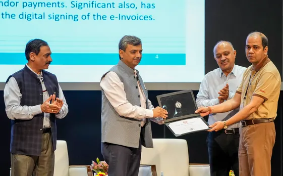 Secretary of Ministry of Housing and Urban Affairs (MOHUA) Manoj Joshi presents an award during DMRC’S 29th Foundation Day event, in New Delhi