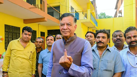 Uttar Pradesh Legislative Assembly Speaker Satish Mahana shows his finger marked with indelible ink after casting his vote for the fourth phase of Lok Sabha elections, in Akbarpur, Uttar Pradesh