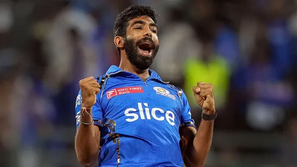 Mumbai Indians bowler Jasprit Bumrah celebrates the wicket of Royal Challengers Bengaluru's batter Virat Kohli during the IPL 2024 cricket match