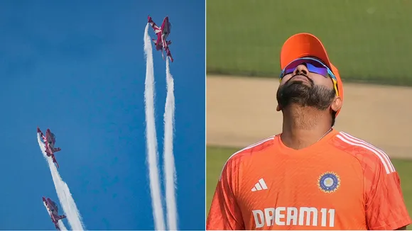 Indian captain Rohit Sharma watches as Indian Air Force’s (IAF) Surya Kiran Aerobatic Team flies past during rehearsal for an air show to be performed during the ICC Men’s Cricket World Cup 2023’s final match between India and Australia, at the Narendra Modi Stadium, in Ahmedabad, Friday, Nov. 17, 2023.