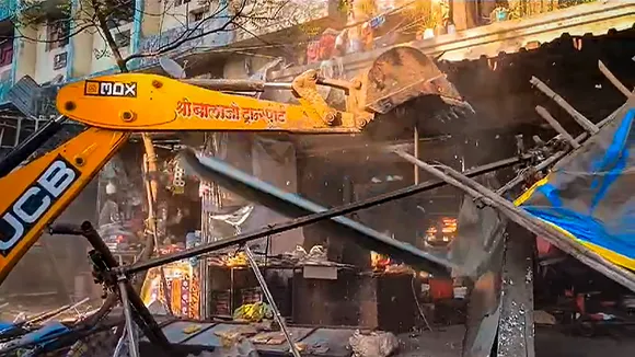 ocal administration carries out demolition drive against alleged illegal structures built on a roadside at Mira Road, in Mumbai, Tuesday, Jan. 23, 2024. Clashes broke out in the area Monday during Ram Mandir consecration. 