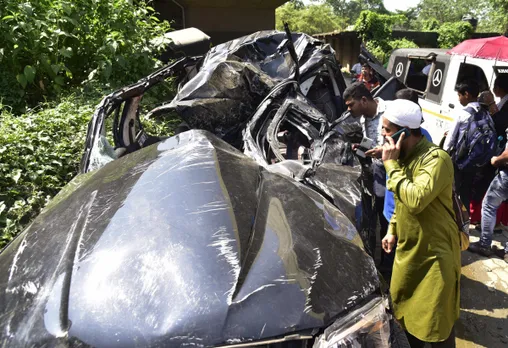 Locals gather near the mangled remains of a Scorpio after it met an accident that reportedly left 7 students of Assam Engineering College dead, at Jalukbari in Guwahati