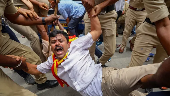 Police detain members of Karnataka Rakshana Vedike during a protest against Cauvery Water Management Authority (CWMA)