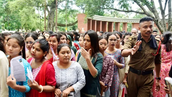 Aspiring candidates of Assam Direct Recruitment Examination (ADRE) wait to enter an examination hall to appear in the examination for the Assam Government Grade-3 jobs, in Guwahati, Sunday, Sept. 15, 2024.