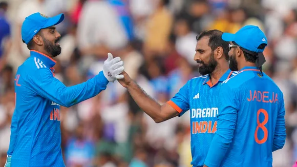  Indian cricketers KL Rahul, Mohammed Shami and Ravindra Jadeja celebrate the wicket of Australian batter Cameron Green during the first ODI cricket match between India and Australia, in Mohali