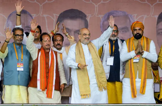 Union Home Minister Amit Shah others during a public meeting in Lakhisarai district