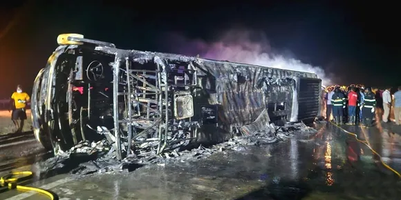 Rescue staff and others at the site after twenty five bus passengers were charred to death when their vehicle caught fire on the Samruddhi Expressway in Maharashtra's Buldhana district, Saturday.jpg