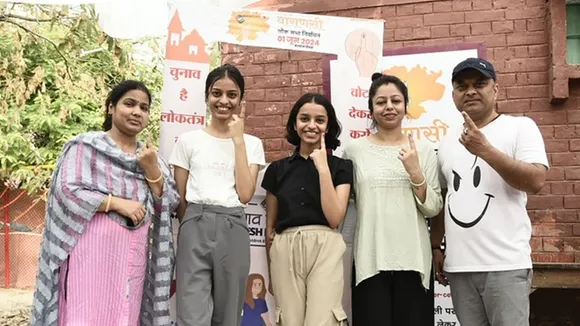 Voters showing mark of indelible ink after casting their votes at a polling booth during the 7th Phase of General Elections-2024 at Primary School, Kabir Chaura, in Varanasi, Uttar Pradesh 