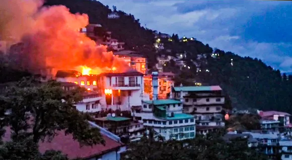 Smoke billows after a fire broke out at a hotel in Mussoorie