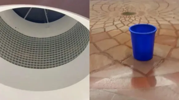 This screenshot shows rain water leaking from a ceiling of the New Parliament building, in New Delhi, Thursday, August 1, 2024.