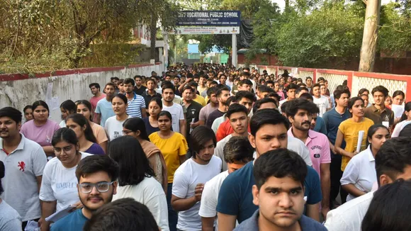 Candidates undergo security check as they arrive to appear for the NEET (UG) 2024 exam at an examination centre