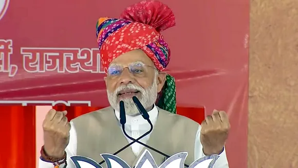 Prime Minister Narendra Modi addresses during a public meeting ahead of Rajasthan Assembly elections, in Pali
