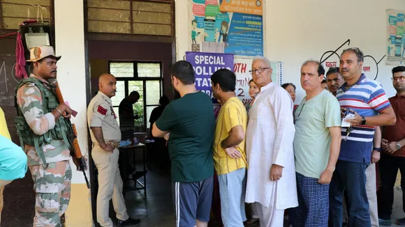 People from the Kashmiri Pandit community wait in queues to cast their votes during the 5th phase of Lok Sabha elections, in Jammu, Monday, May 20, 2024