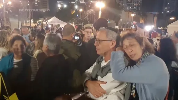 Israeli people await hostages at the border