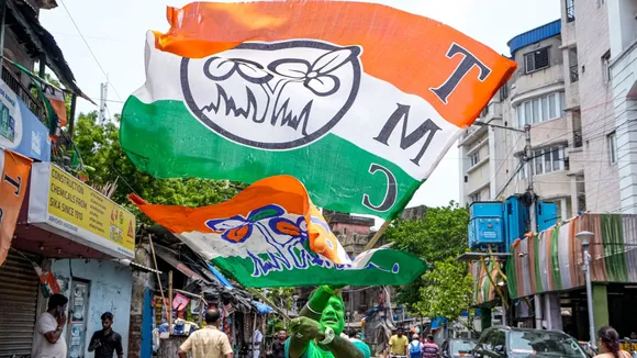 TMC supporters celebrate the party's lead during counting of votes for Lok Sabha elections, outside party supremo Mamata Banerjee's Kalighat residence, in Kolkata, Tuesday, June 4, 2024