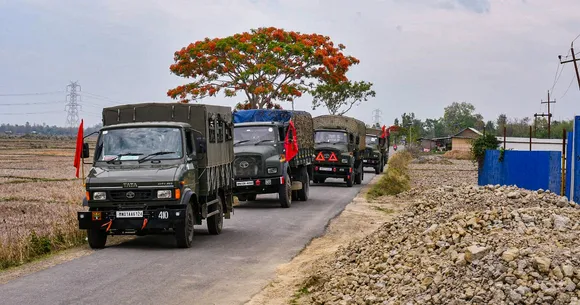 Army and Assam Rifles personnel conduct a flag march in violence-hit areas amid tribal groups' protest over court order on Scheduled Tribe status, Manipur