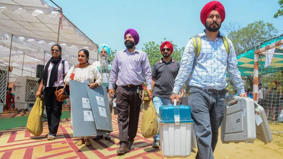 Polling officials check the election material at a distribution center before leaving for their respective polling stations, on the eve of the seventh phase of Lok Sabha elections, in Amritsar, Friday, May 31, 2024
