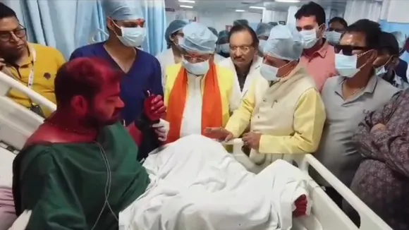 Madhya Pradesh CM Mohan Yadav and state minister Kailash Vijayvargiya meet victims of Ujjain Mahakal Temple fire at a hospital in Indore.