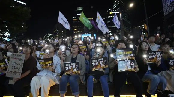 Citizens stage a rally against deepfake sex crime in Seoul, South Korea, Friday, Sept. 27, 2024. The banners read “You can’t insult us.” 