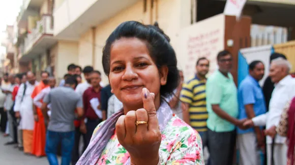 Woman voter shows ink mark after casting vote, during the sixth phase of Lok Sabha elections, in Gurugram, Saturday, May 25, 2024
