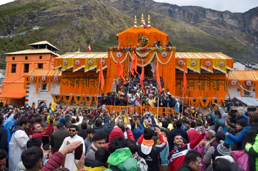 Devotees arrive at the Shri Badrinath temple after its portals were opened, in Chamoli district, Sunday morning, May 12, 2024