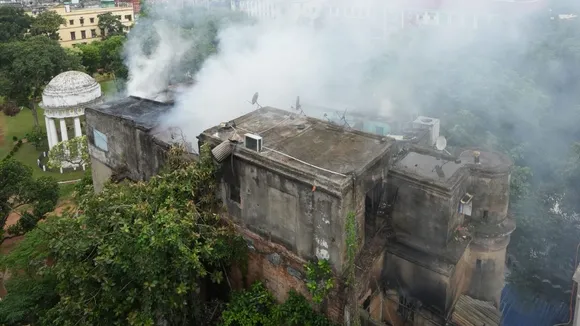 Smoke billows out after a century-old building caught fire, at Dalhousie area in Kolkata, Saturday, June 22, 2024
