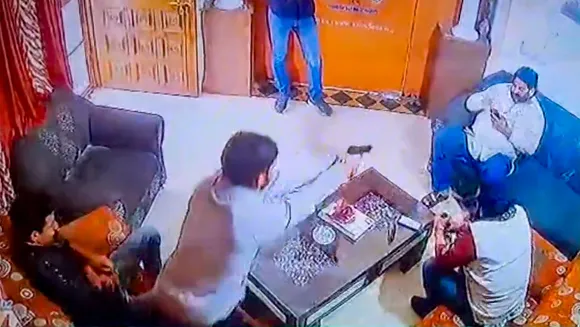 In this screenshot taken from a CCTV footage, Shri Rashtriya Rajput Karni Sena's president Sukhdev Singh Gogamedi being shot dead in the living room of his house, in Jaipur, Tuesday, Dec. 5, 2023.