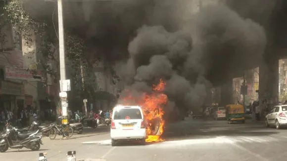 A taxi car was reduced to ashes after the moving vehicle caught fire in the Uttam Nagar area in west Delhi on Monday