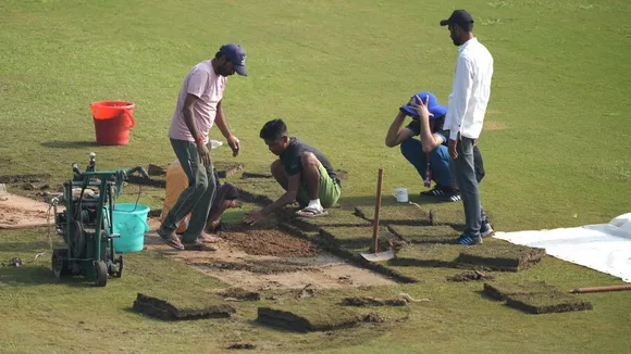 Ground staffers prepare the ground before the start of the second day of one-off Test match between Afghanistan and New Zealand, in Greater Noida, Tuesday, Sept 10, 2024.