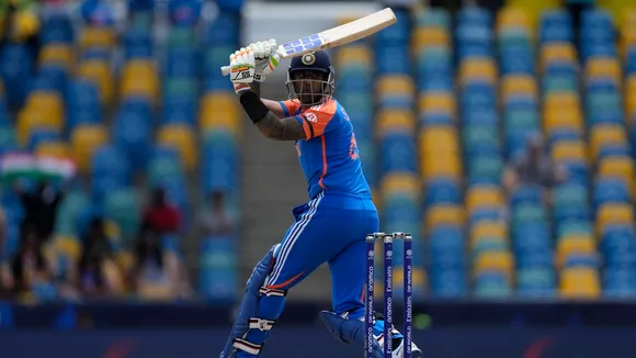 Suryakumar Yadav watches the ball after playing a shot during the ICC Men's T20 World Cup cricket match between Afghanistan and India at Kensington Oval in Bridgetown, Barbados, Thursday, June 20, 2024.