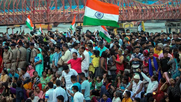 Supporters gather at Har Ki Pauri ghat where protesting wrestlers arrived to immerse their medals in the Ganga river as a mark of protest against WFI chief Brij Bhushan Singh over sexual harassment allegations, in Haridwar, on May 30, 2023. The wrestlers dropped their plan to immerse medals in the river after a request from farmer leaders.