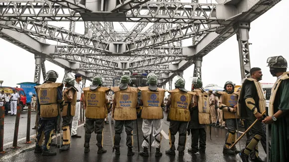 Police personnel deployed at Howrah Bridge in view of 'Nabanna Abhijan' rally called by Paschim Banga Chhatra Samaj, a students' organisation, to protest against the alleged sexual assault and murder of a trainee doctor, in Kolkata, Tuesday, Aug. 27, 2024.