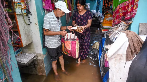 People at their flooded house after heavy monsoon rainfall, in Bardhaman, Tuesday, Aug. 6, 2024