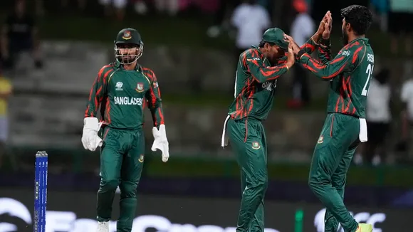 Bangladesh's Rishad Hossain, right, celebrates with teammates after taking the wicket of Australia's captain Mitchell Marsh during the ICC Men's T20 World Cup cricket match between Australia and Bangladesh in North Sound, Antigua and Barbuda, Thursday, June 20, 2024.