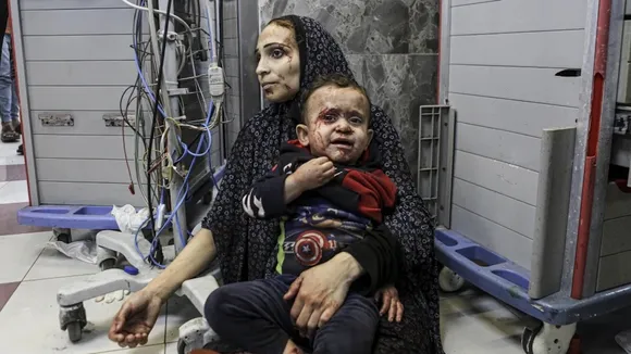 Wounded Palestinians wait for treatment in al-Shifa hospital in Gaza City