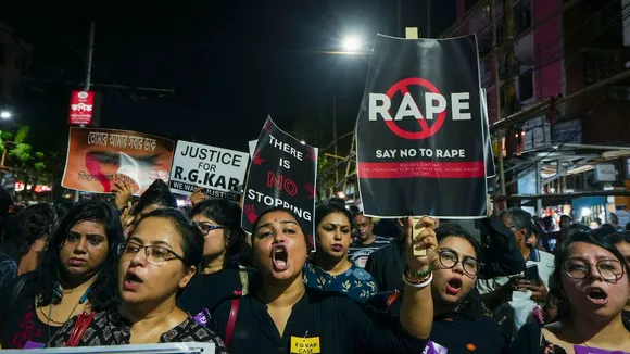 Women shout slogans as they take part in a protest march over the alleged sexual assault and murder of a trainee doctor, in Kolkata, Sunday, Sept. 8, 2024.
