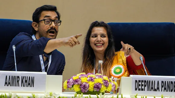 Actor Aamir Khan with with a school Principal Deepmala Pandey during an interaction session at the National Conclave on 'Mann Ki Baat @100' on April 26
