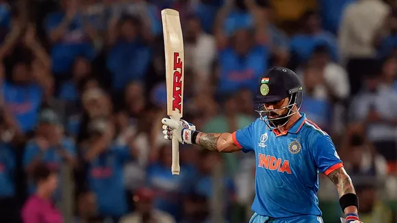 Virat Kohli celebrates his half century during the ICC Men's Cricket World Cup 2023 match between India and Bangladesh, at Maharashtra Cricket Association Stadium, in Pune, Thursday, Oct. 19, 2023.