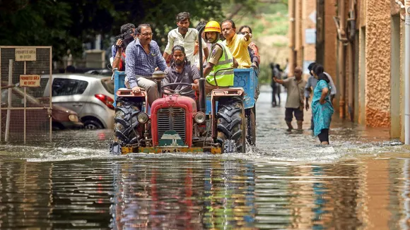 Residents of waterlogged Kendriya Vihar Apartments being shifted to a safer place after heavy rainfall, in Bengaluru, Sunday, Oct. 6, 2024.