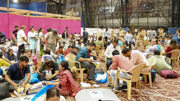 Polling officials check the election material before leaving for their designated polling stations on the eve of the sixth phase of Lok Sabha elections, at the Commonwealth Games Village, in New Delhi, Friday, May 24, 2024